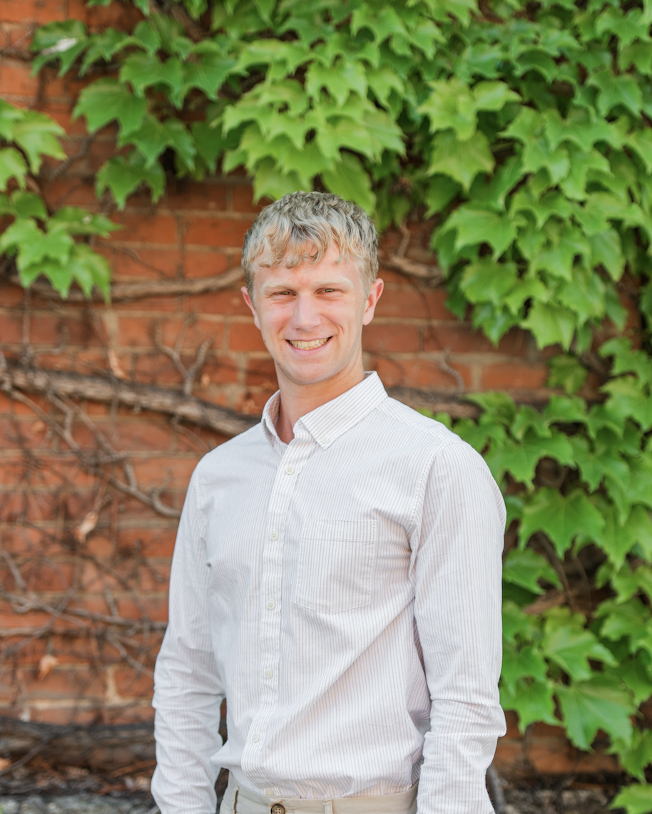 Thomas smiling for a photo